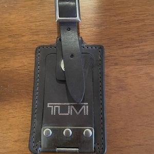 Tumi black leather tag